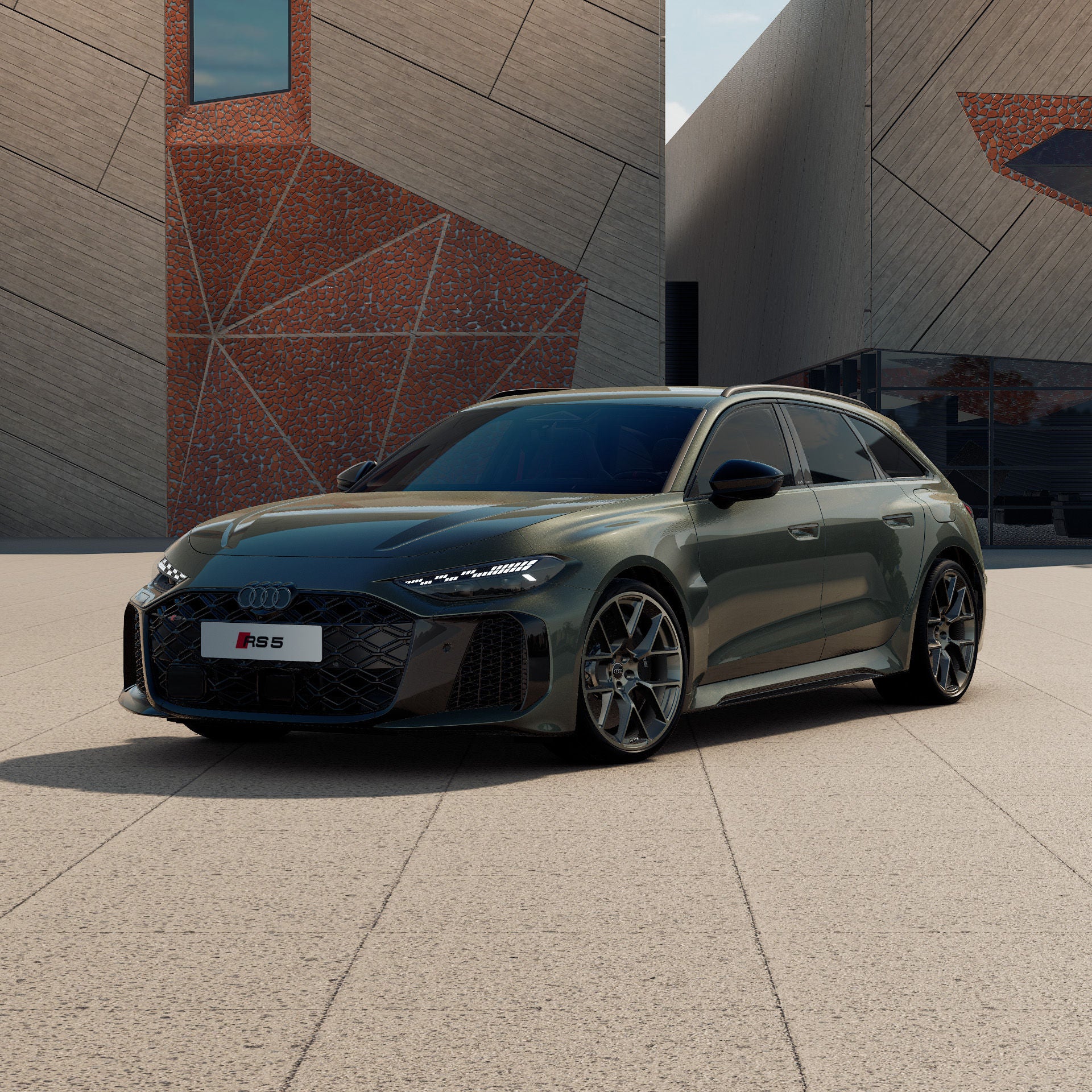  Dunkler RS 5 Avant vor einem modernen Gebäude