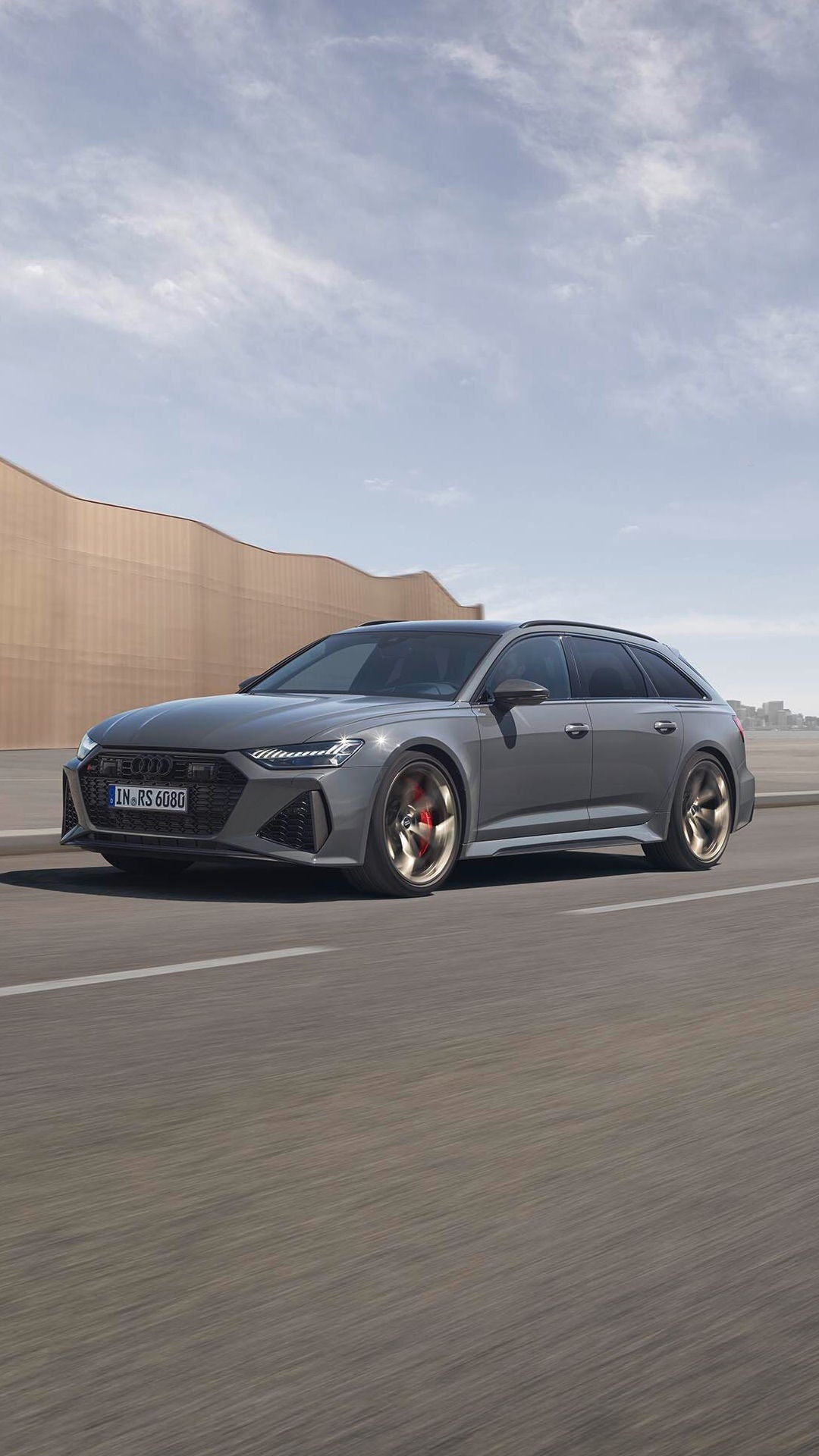 The Audi RS 6 Avant Performance driving on an urban road.