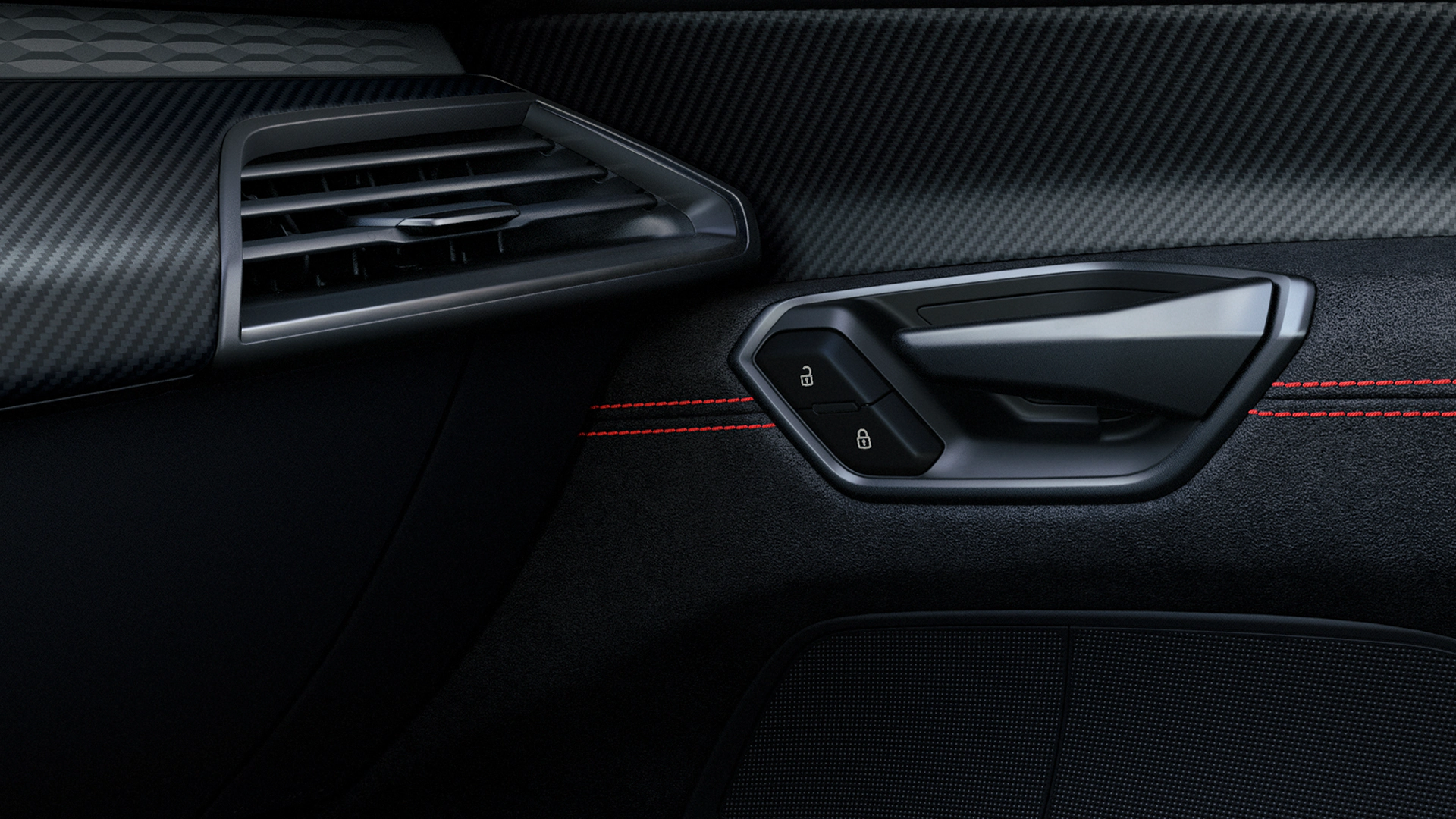 Car door interior with air vent, handle, and lock buttons on black panel with red stitching.