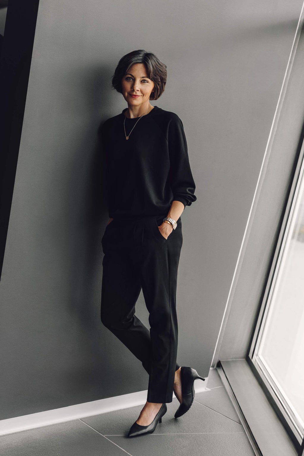 Andrea Haas leaning against a wall.