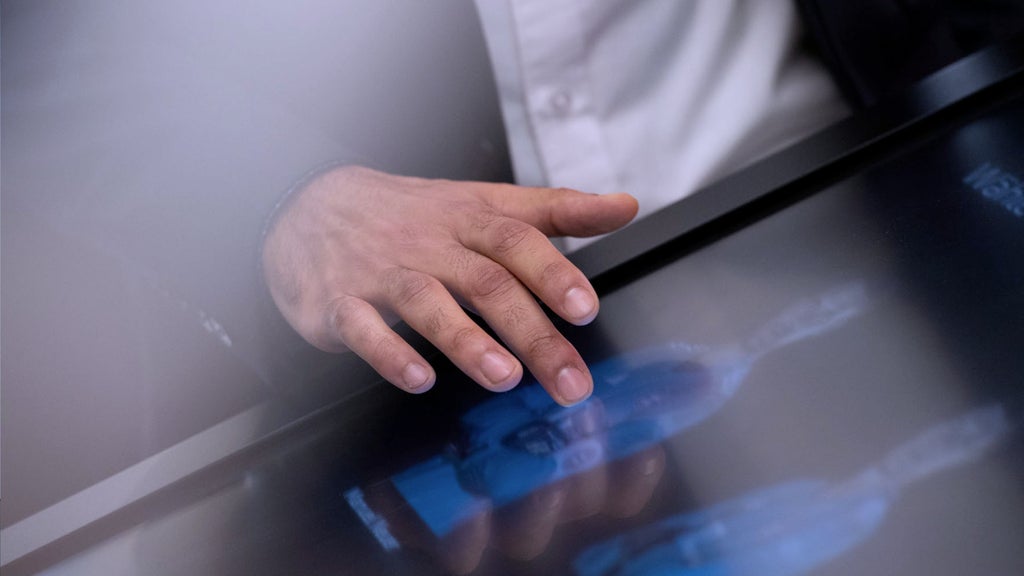 A hand is touching a screen