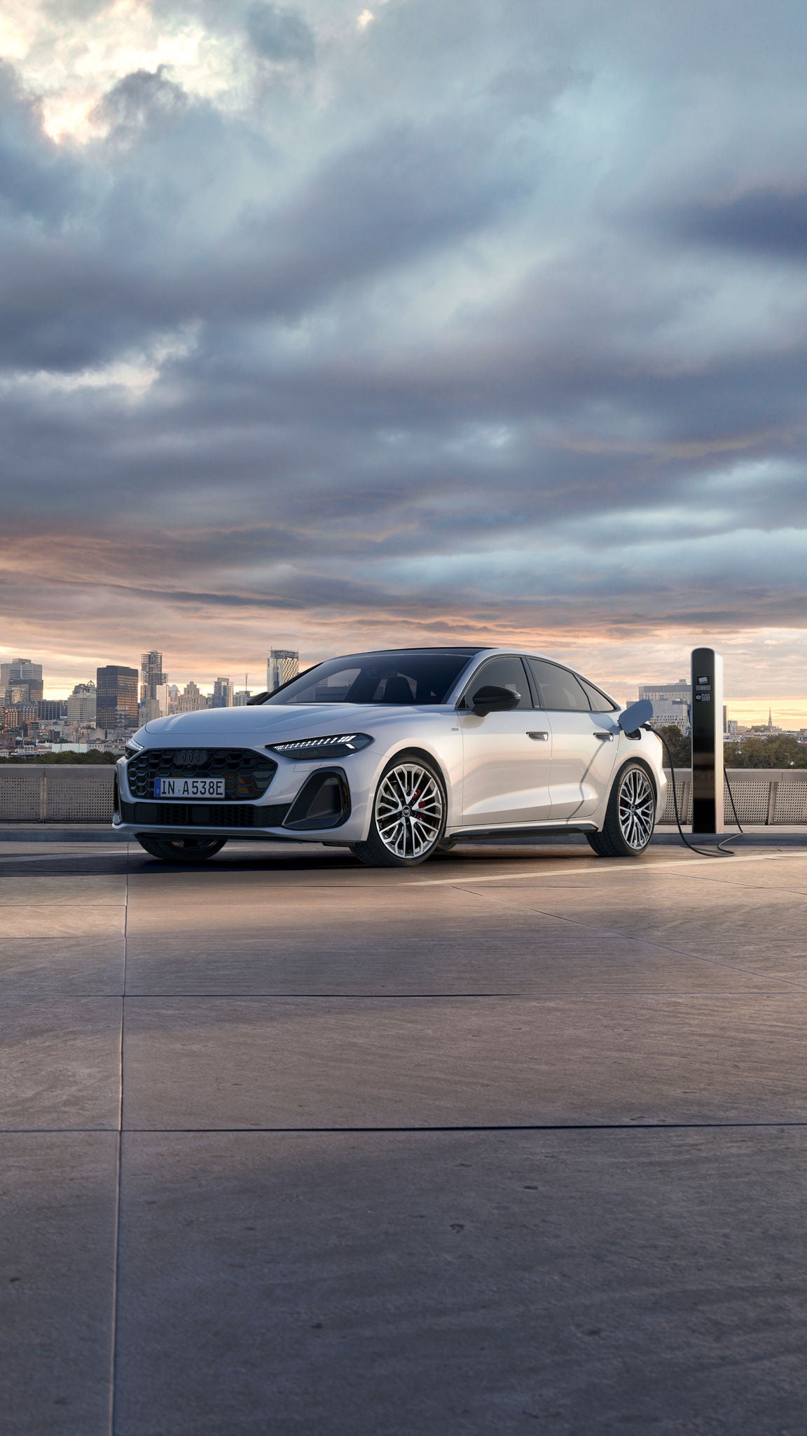 Audi A5 Sportback e-hybrid Charging. Standing next to the charging station