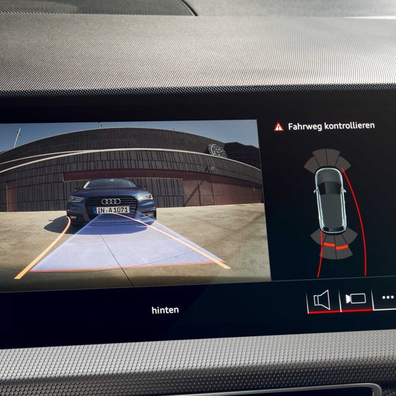 Internal touch screen showing vehicle camera of outside.