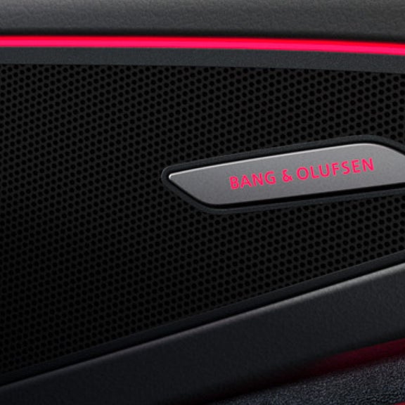 A car with active safety feature graphics on a road with lane markings.