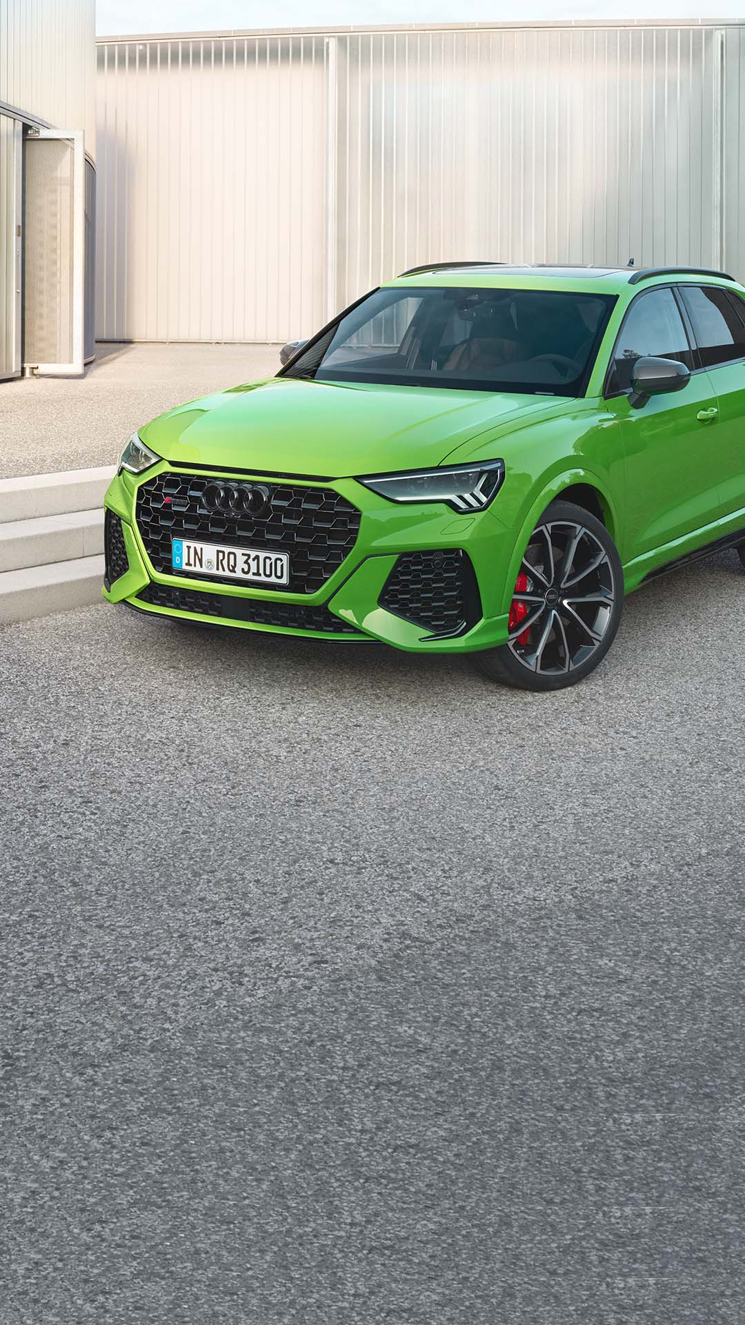 Frontal side view of the RS Q3 with man on the side