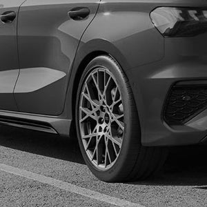 A grey image of a back wheel featuring rims