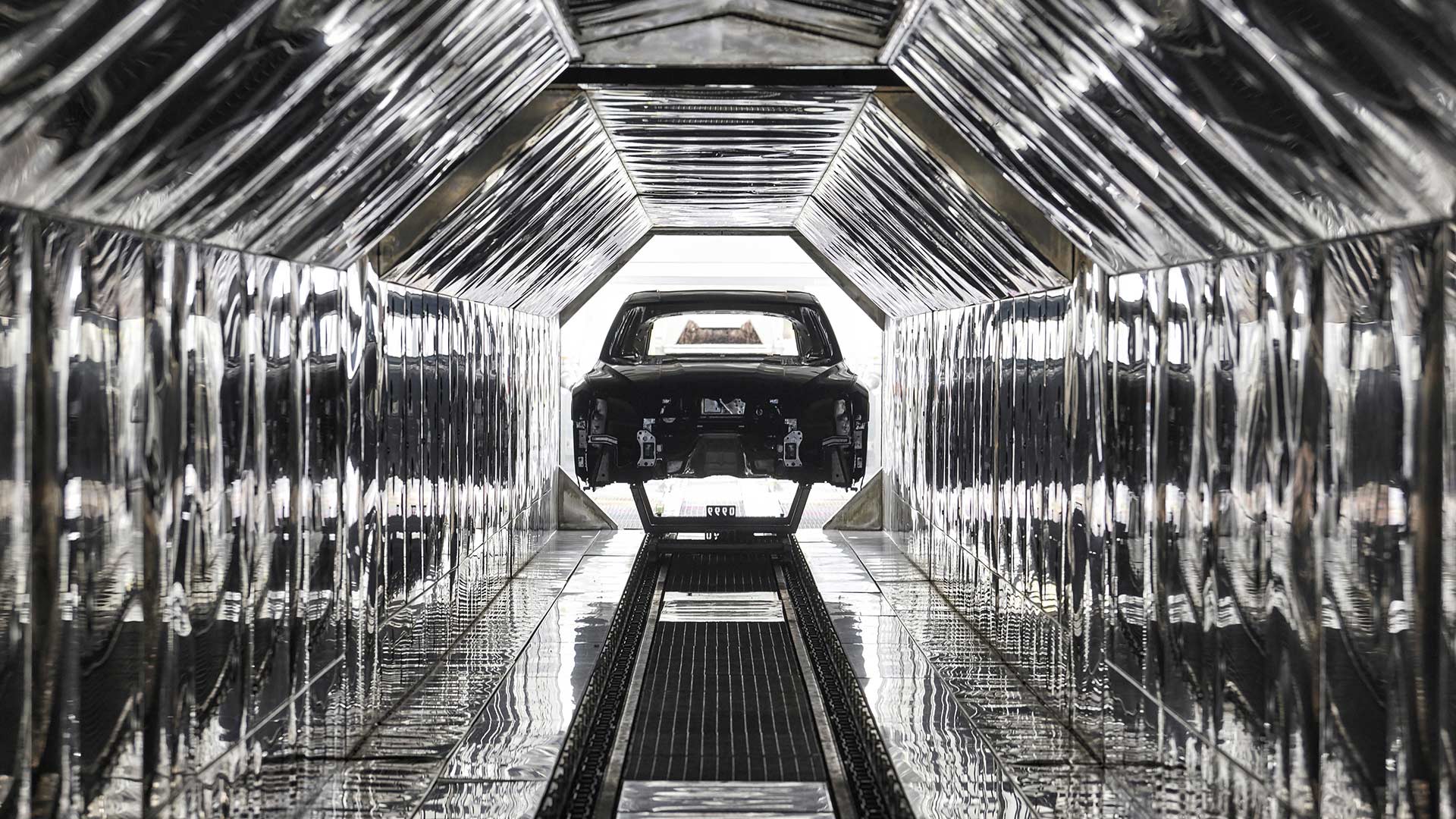 audi in a gray constructions room