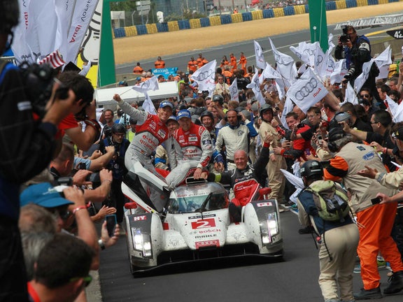 A picture showing the victory of the Audi R18 e-tron quattro at Le Mans in 2014.