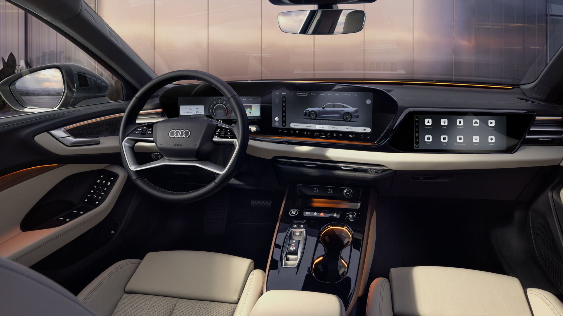 View from the rear seat into the cockpit of the A5 Saloon. Visible features include the MMI displays and the lighting design, featuring the interaction light at the base of the windshield.
