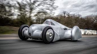 Driving shot at the first roll-out of the recreated silver coloured Auto Union Lucca on the speedway.