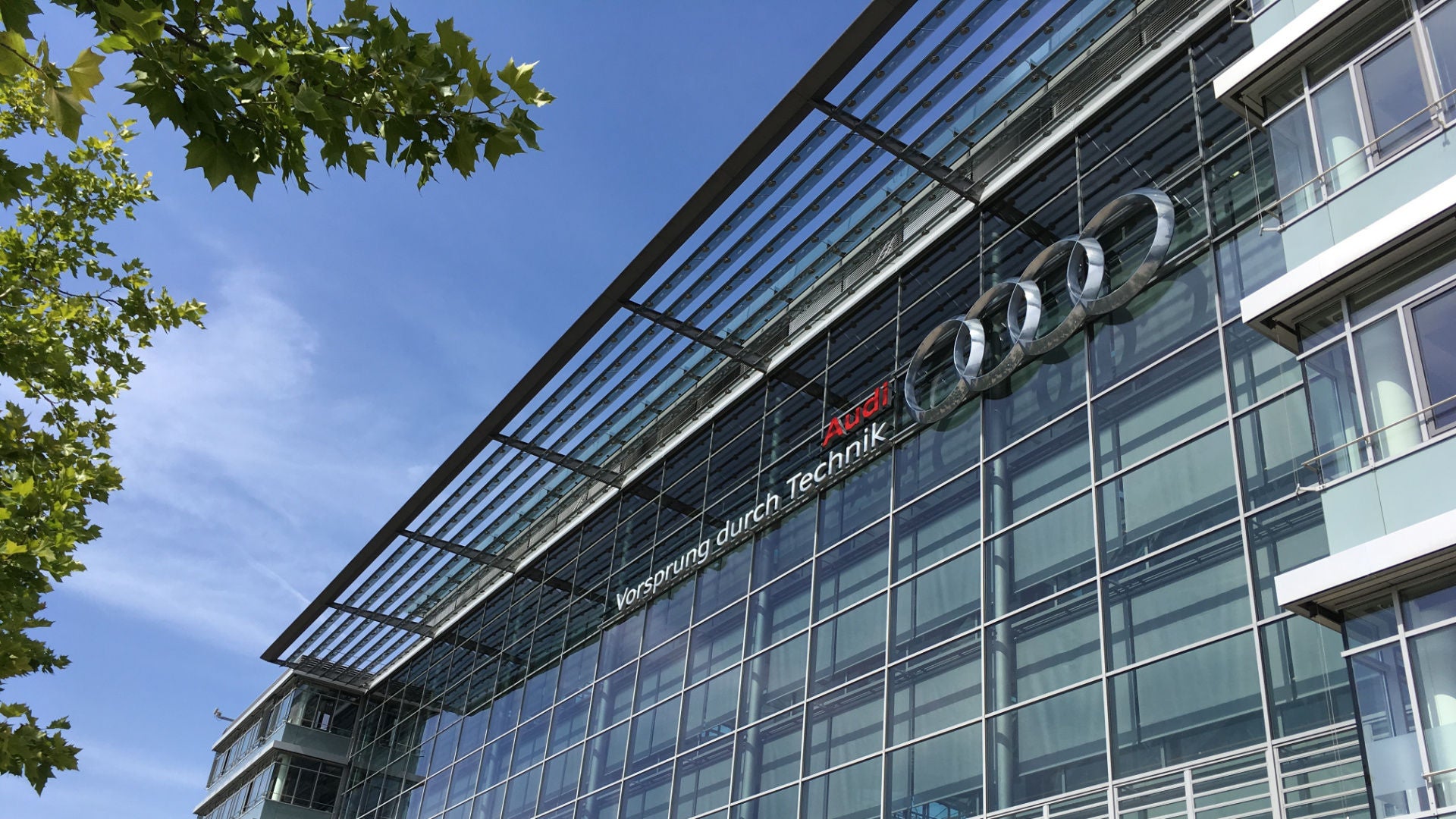 Façade of the Audi headquarters in Ingolstadt with the Audi logo and the four rings