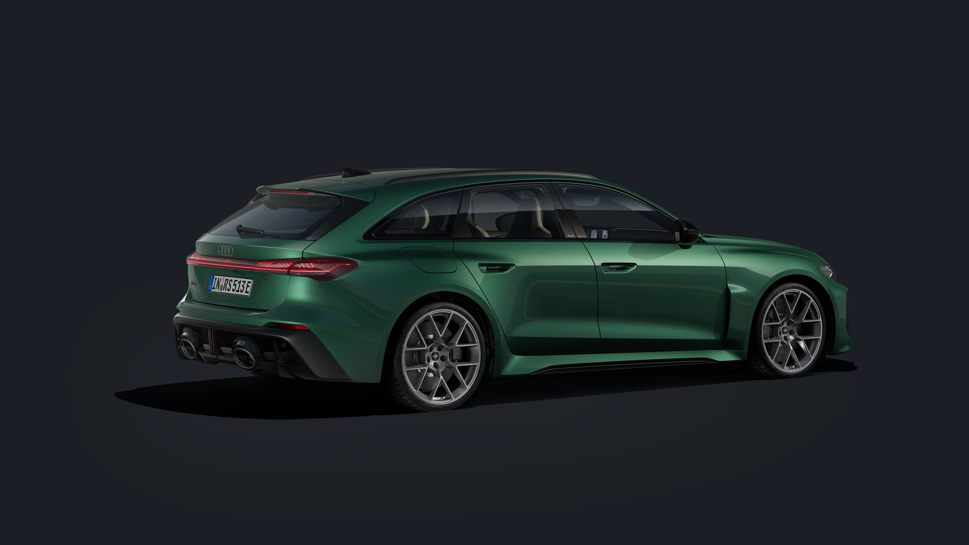 The RS 5 Avant from the side with custom paintwork in avocado green and 21-inch wheels in a 6-double-spoke design.