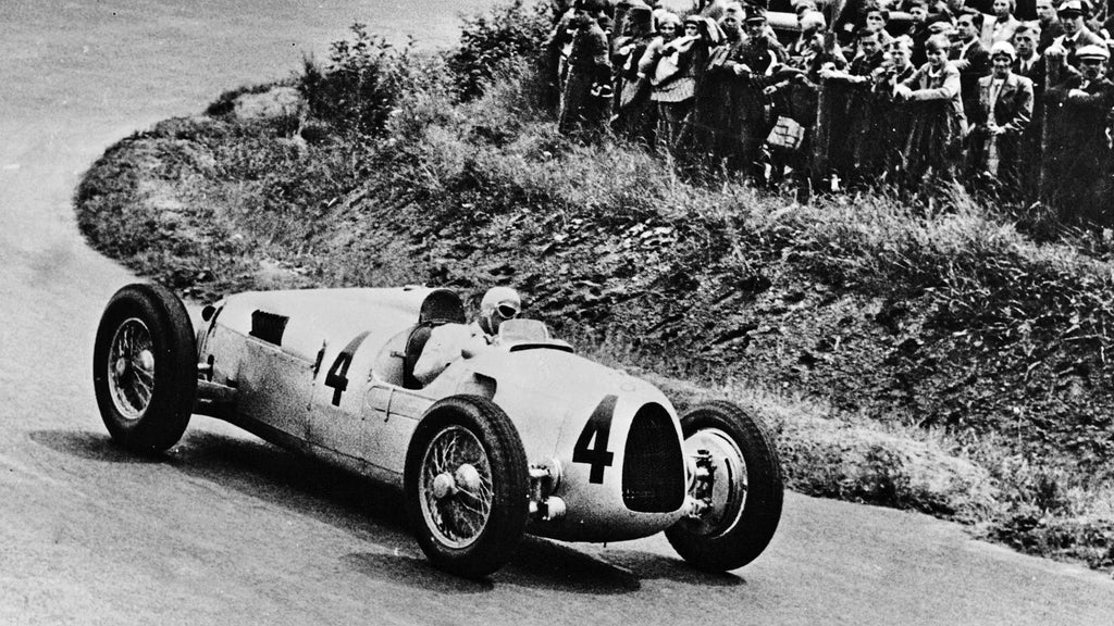 A picture showing an Auto Union Type C Grand Prix race car on track at the Nürburgring in 1936.