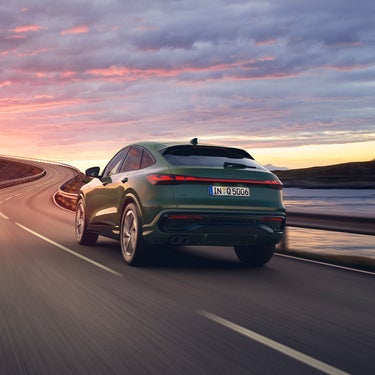 Q5 driving into sunset