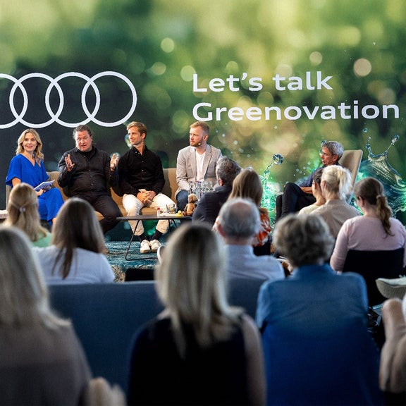 Various people sit on the stage at Kieler Woche