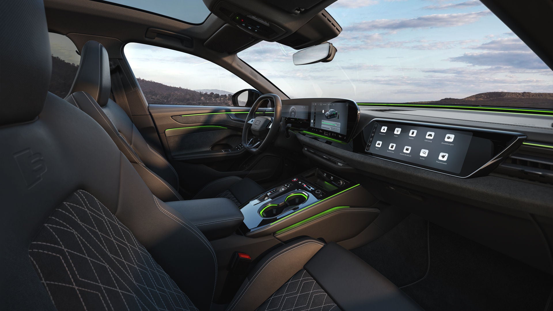 Das Cockpit der A6 Limousine e-hybrid aus Beifahrerperspektive. Der Fokus liegt dabei auf dem Lenkrad sowie den Panorama-Displays und dem grünen Ambiente-Licht.