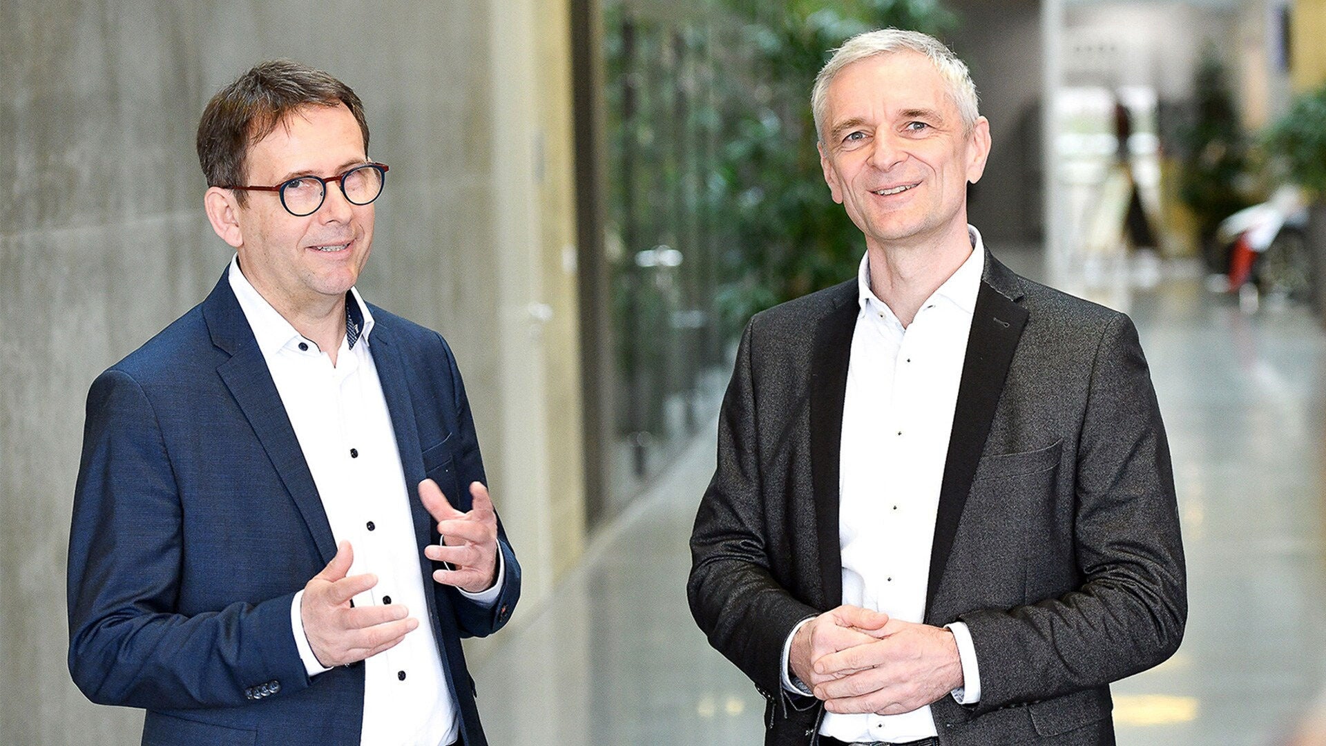 Thomas Hasenbank and Michael Korte are talking to someone behind the camera