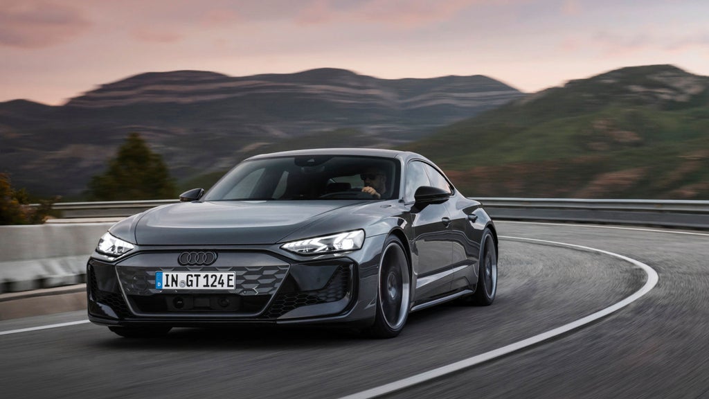 An Audi RS e-tron driving through a bend.
