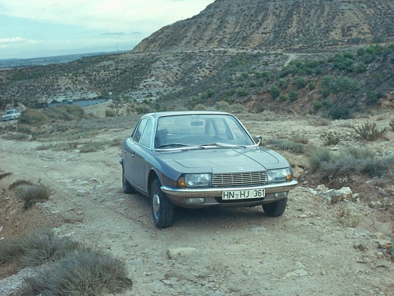 Photo of a gray-silver NSU Ro80 on a slope in the mountains