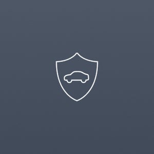 Outline of a car inside a shield symbol on a plain light grey background, suggesting concepts of vehicle protection or insurance. Minimalist design.
