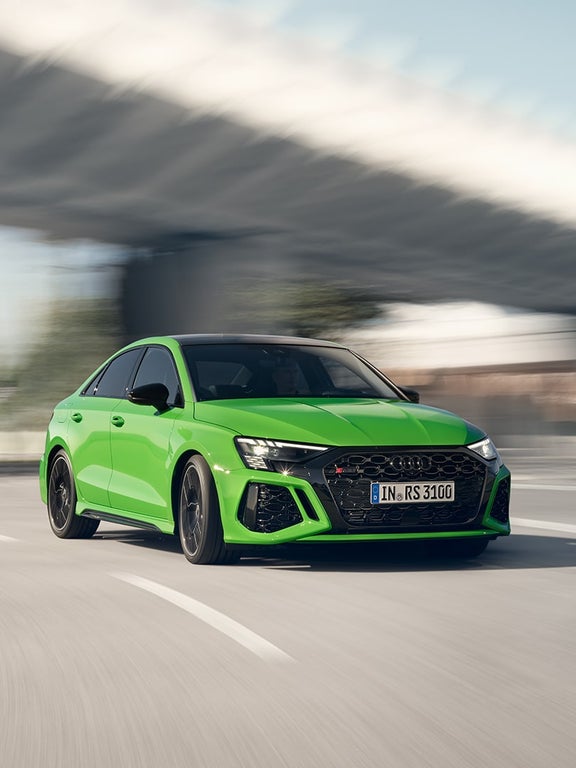 Audi RS 3 sedan side view on the road
