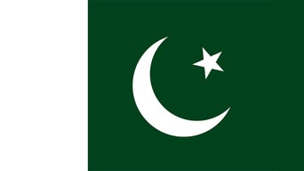 Flag of Pakistan with green field, white stripe, crescent and star in white.