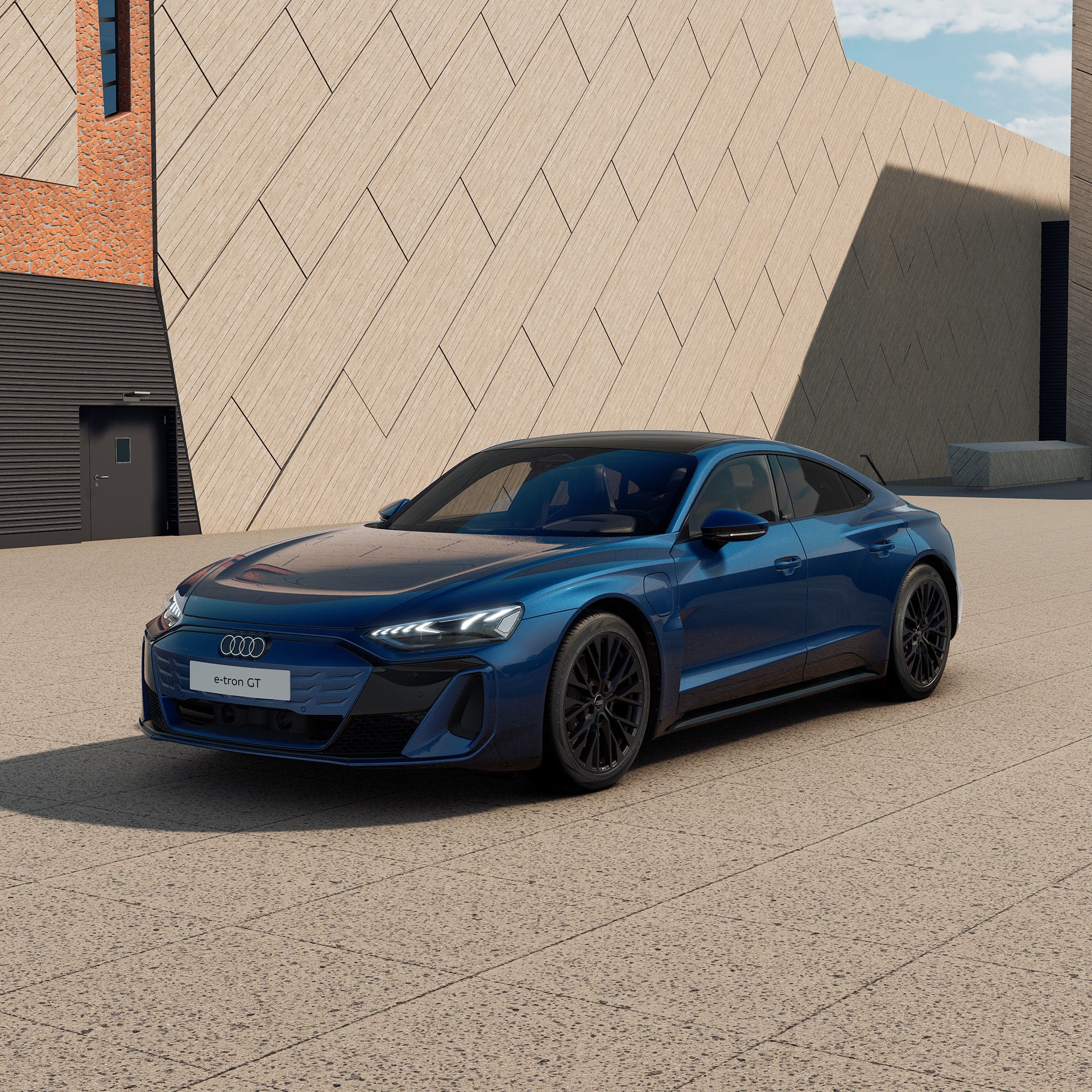 3/4 Ansicht eines blauen Audi e-tron GT quattro  vor einem modernen Gebäude