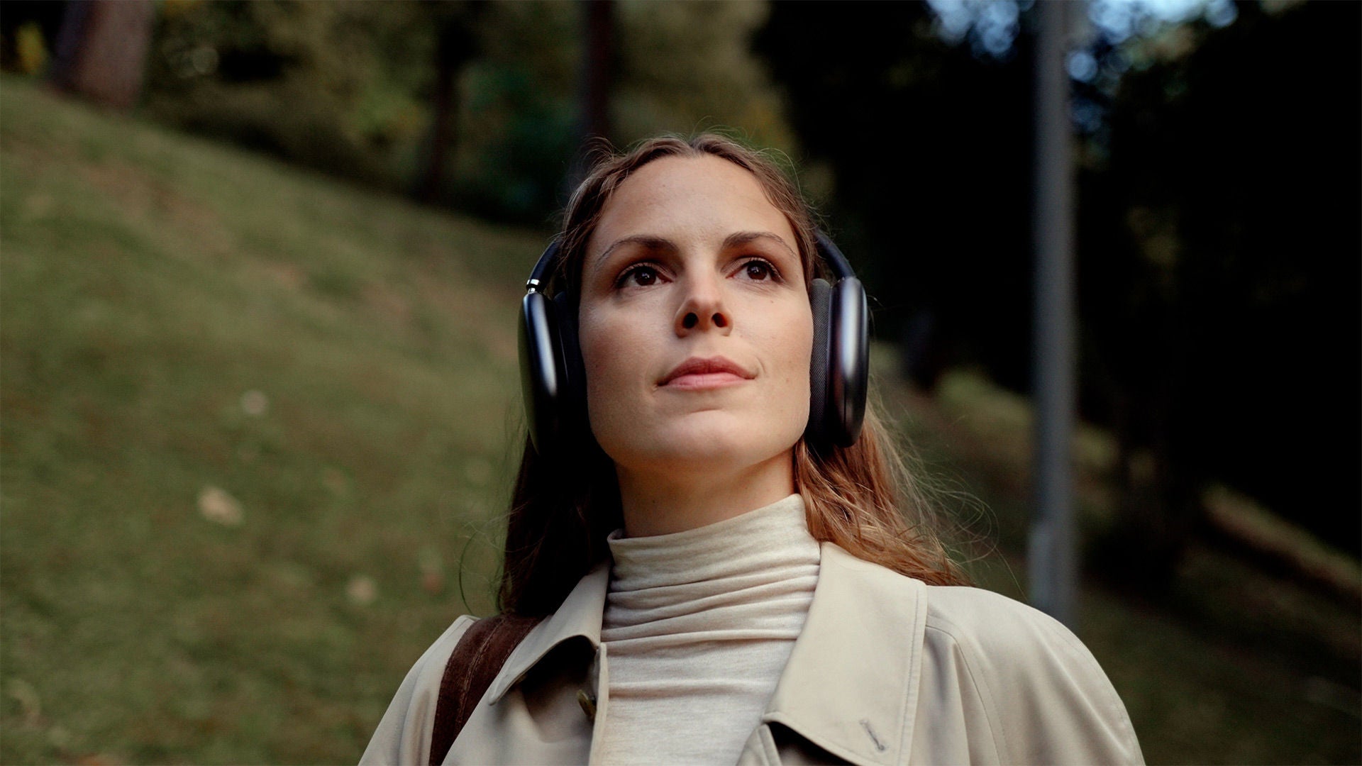 Audi RS e-tron GT sports car on a concrete surface in front of futuristic architecture