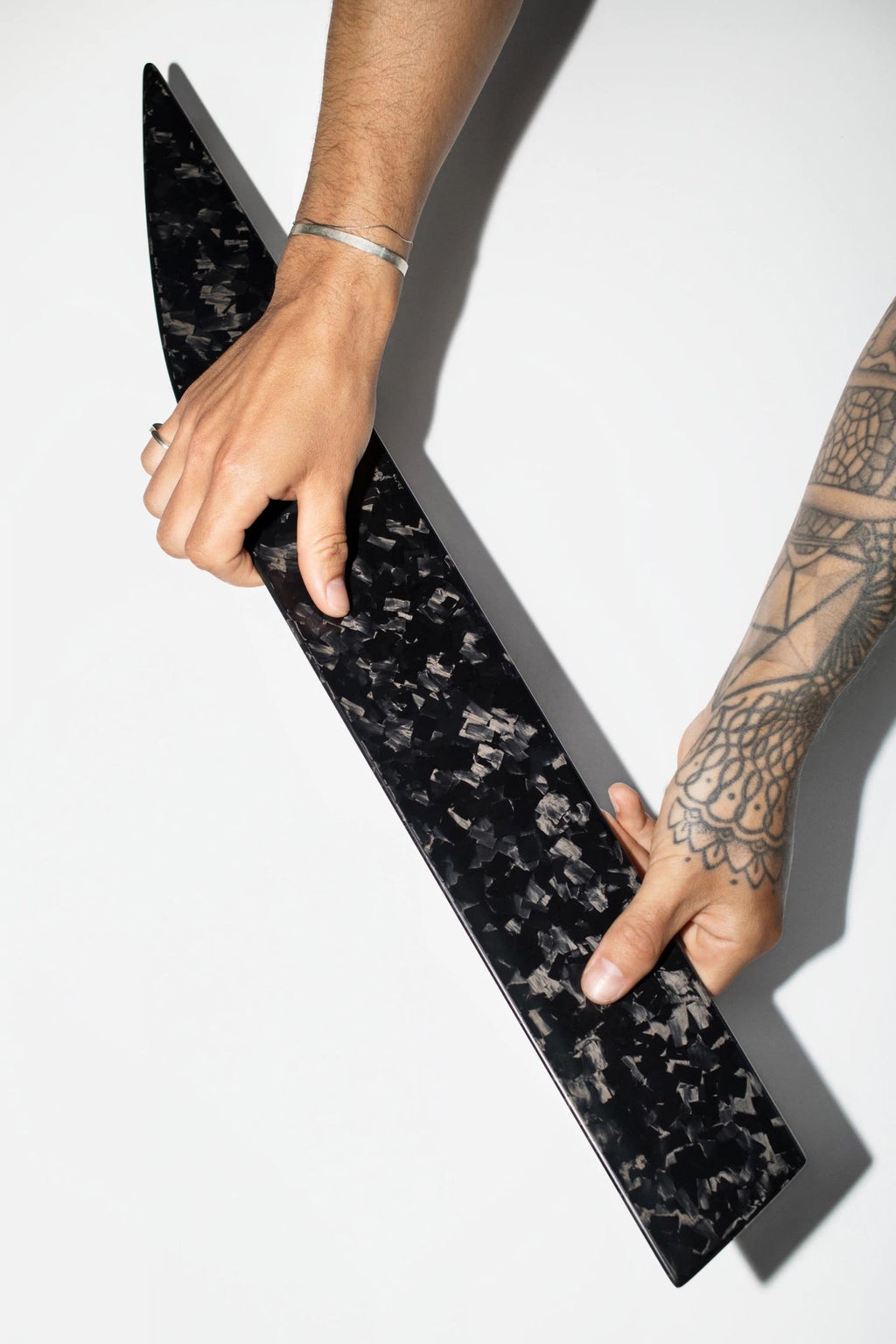 A component in carbon camouflage in the hands of Kröner.